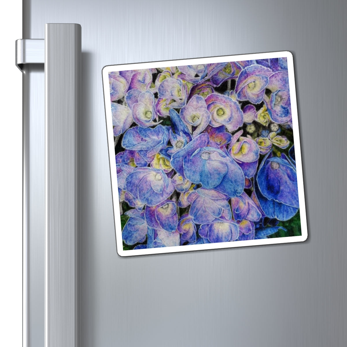 a blue, pink, and yellow Floral magnet on a refrigerator door