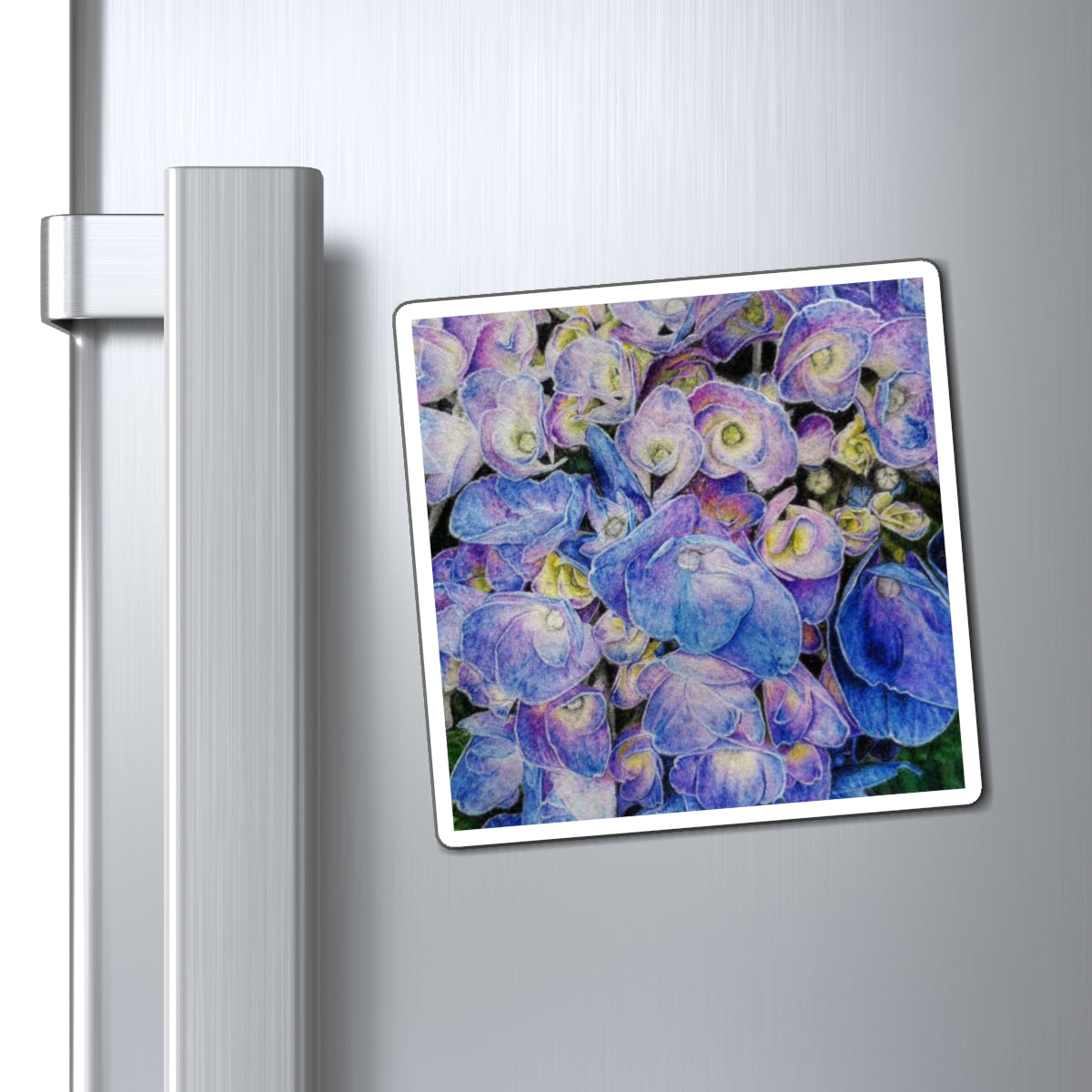 Fridge magnet with a floral design attached to a refrigerator