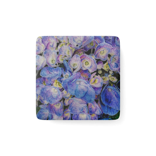 A magnet with a purple floral design on a white background