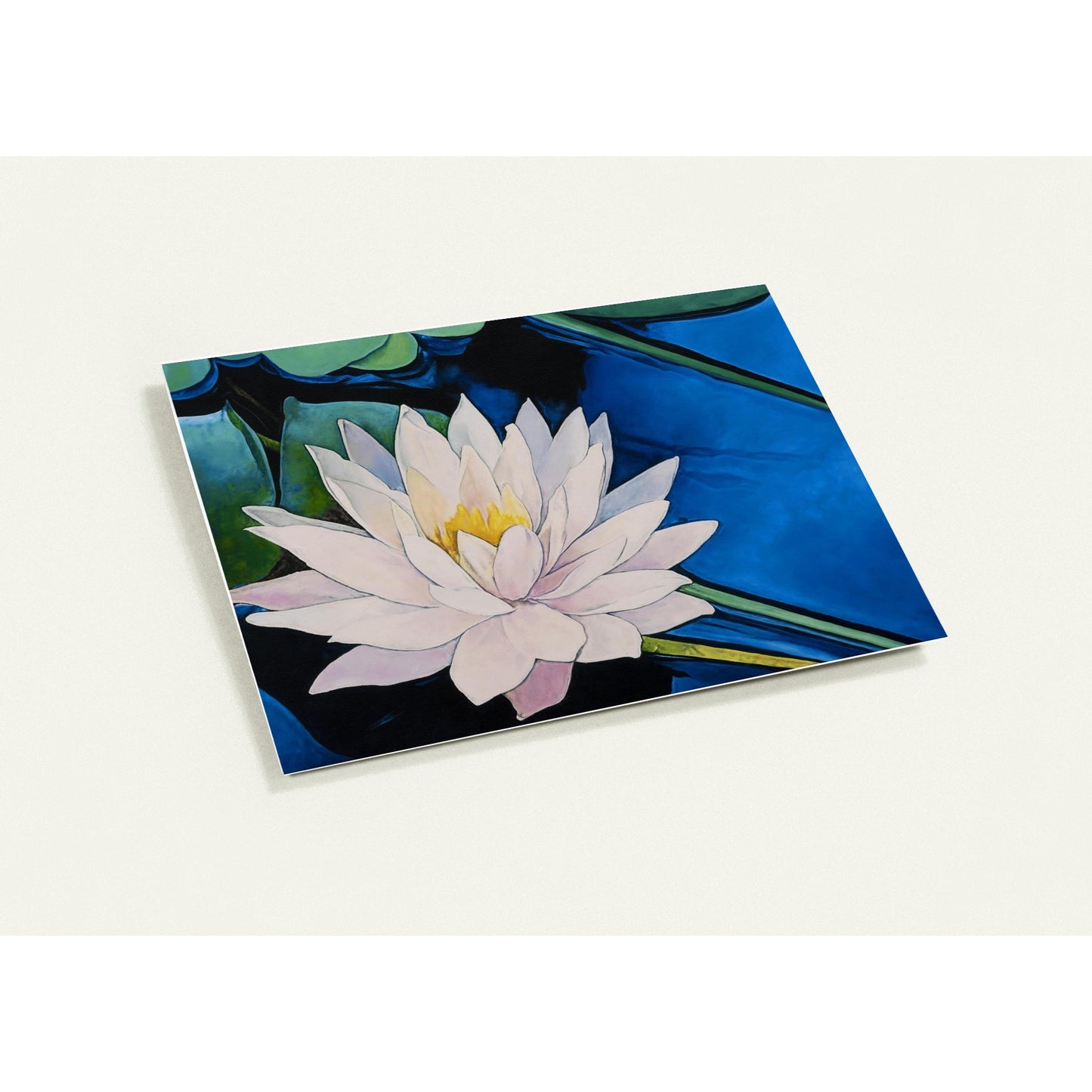 Card with a design of a pink water lily on a blue background