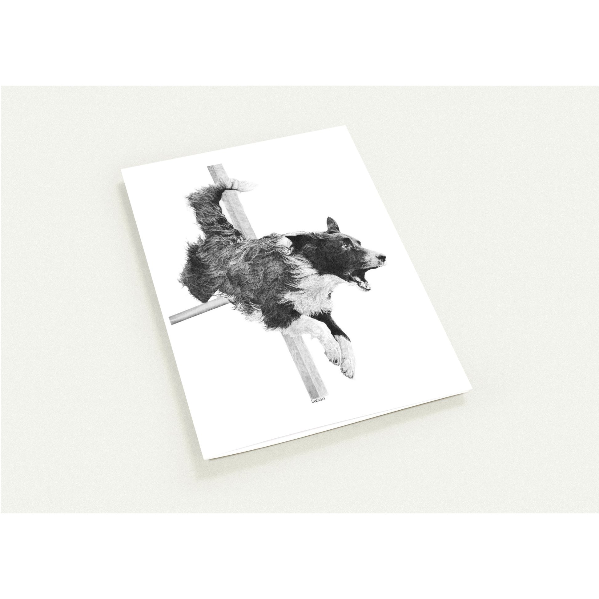 Note card with a black and white illustration of a dog on a white background